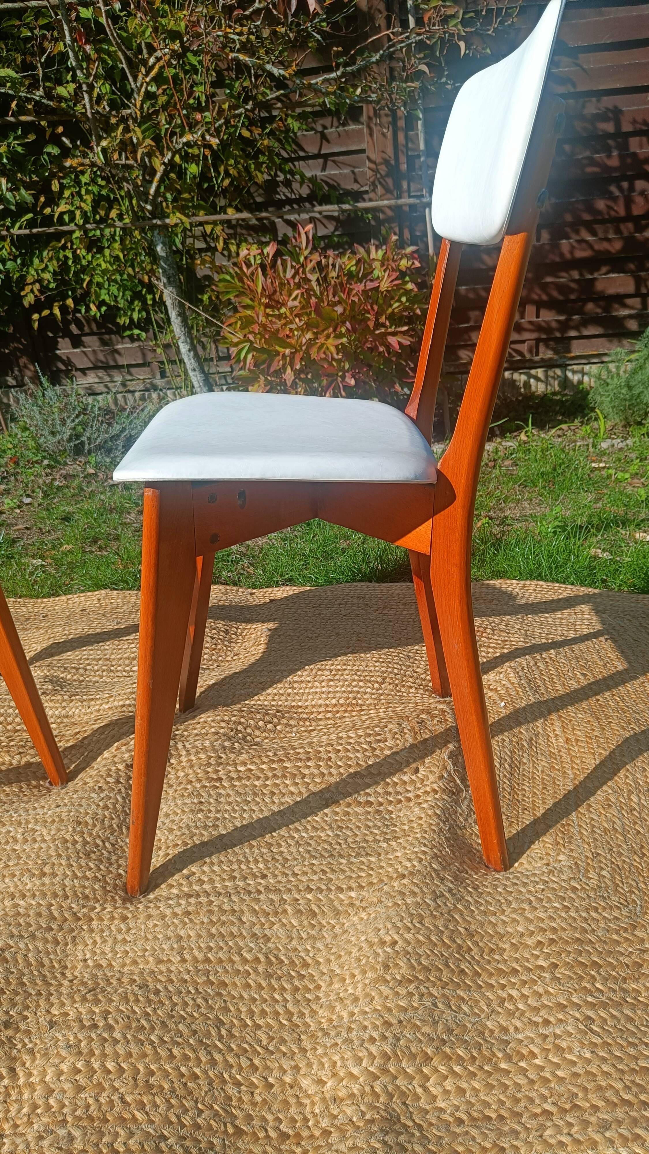 vintage wooden chairs with white faux leather