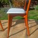 vintage wooden chairs with white faux leather