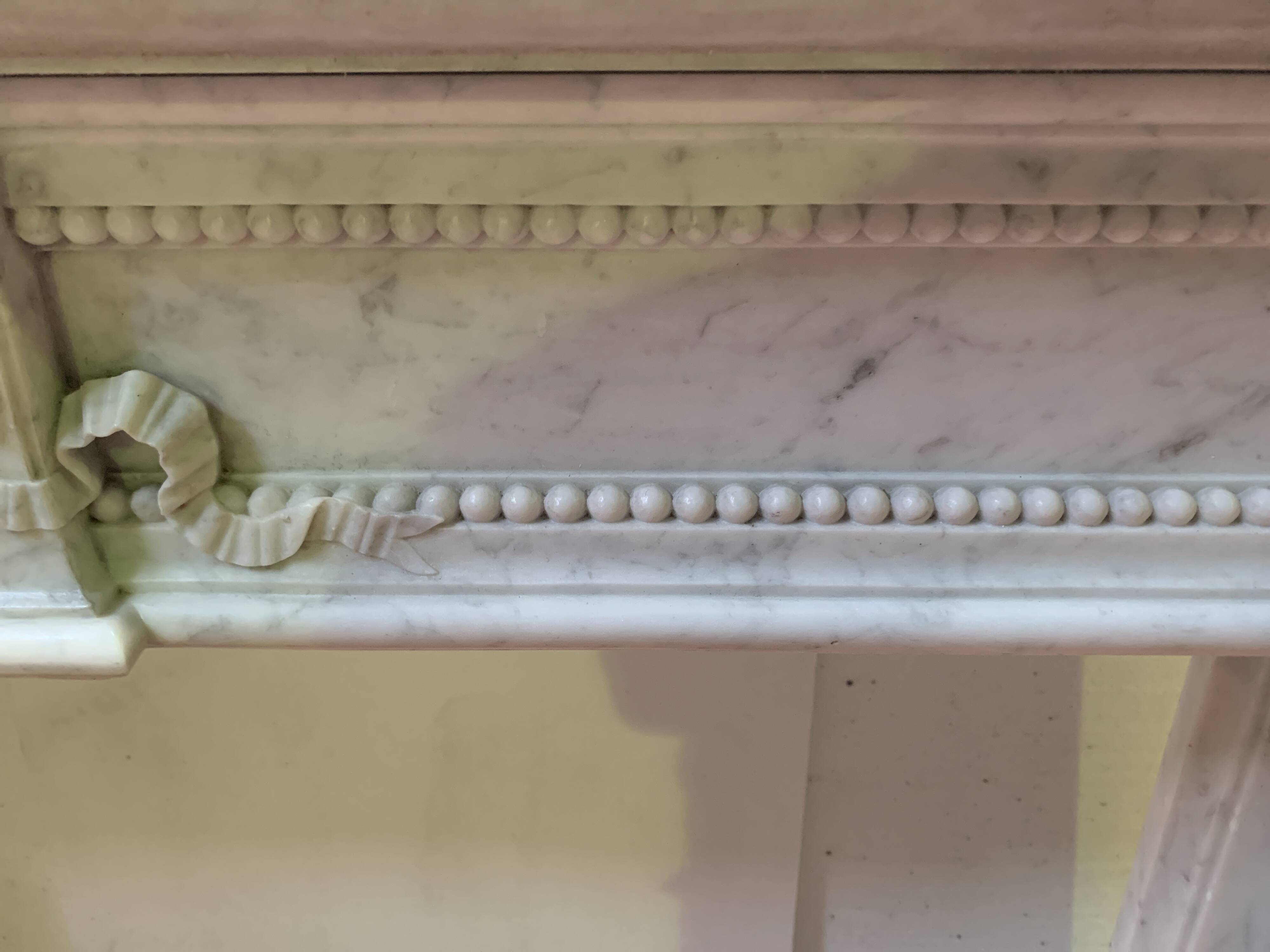Louis XVI style fireplace in white Carrara marble, 19th century