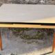 Beige French modernist extendable table, wooden legs, circa 1955.