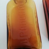 2 amber apothecary bottles