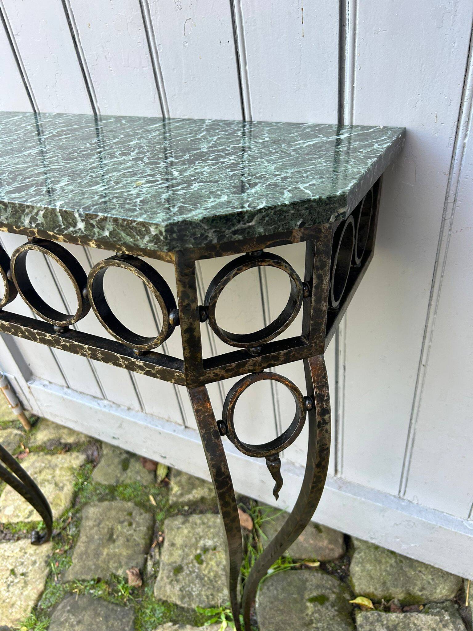 Console in wrought and hammered iron and green marble