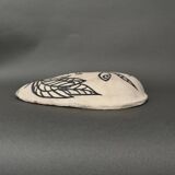 Africanist mask in glazed white terracotta, face signed Colette.