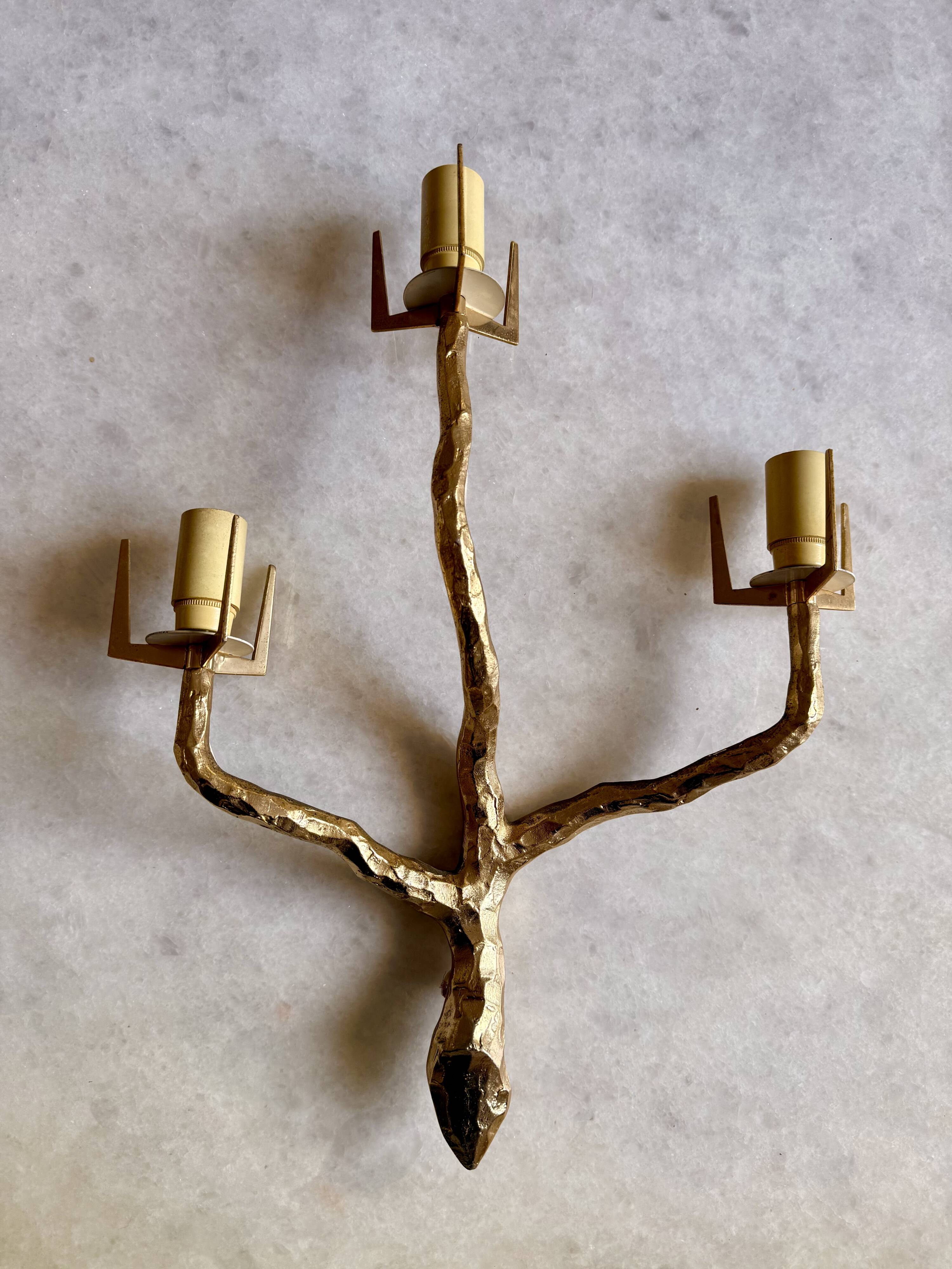 Pair of wall lights by Maison Arlus by Felix Agostini in bronze.