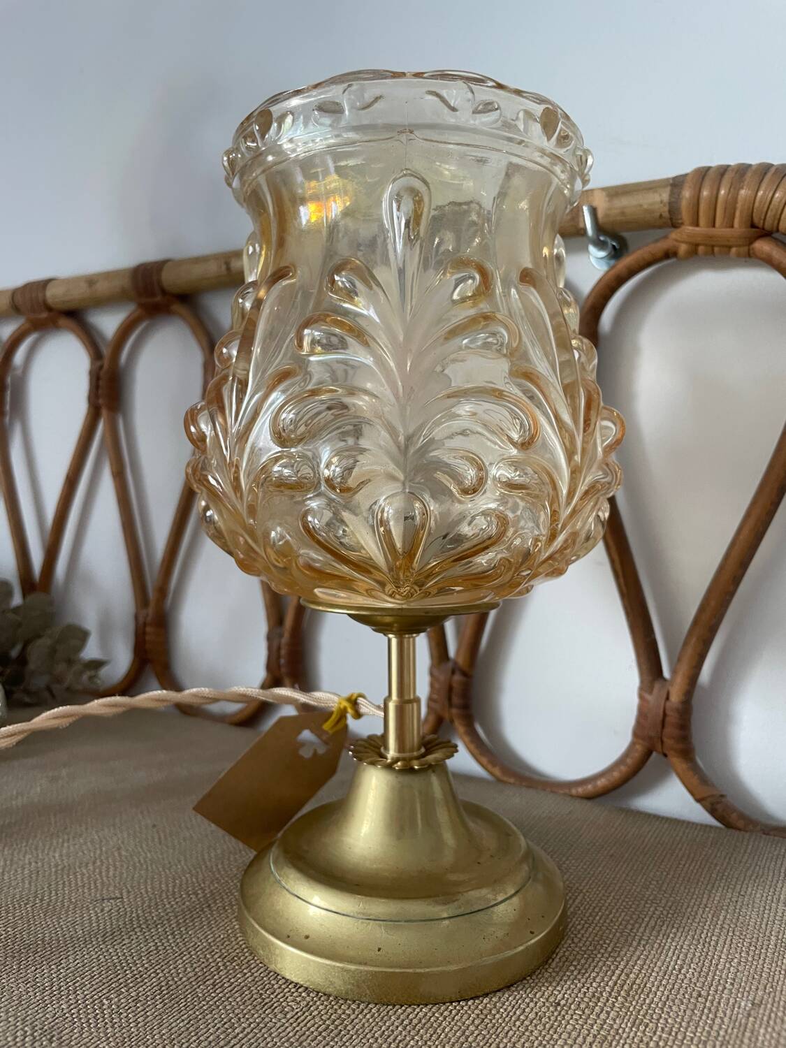 Table lamp with amber glass globe and brass base