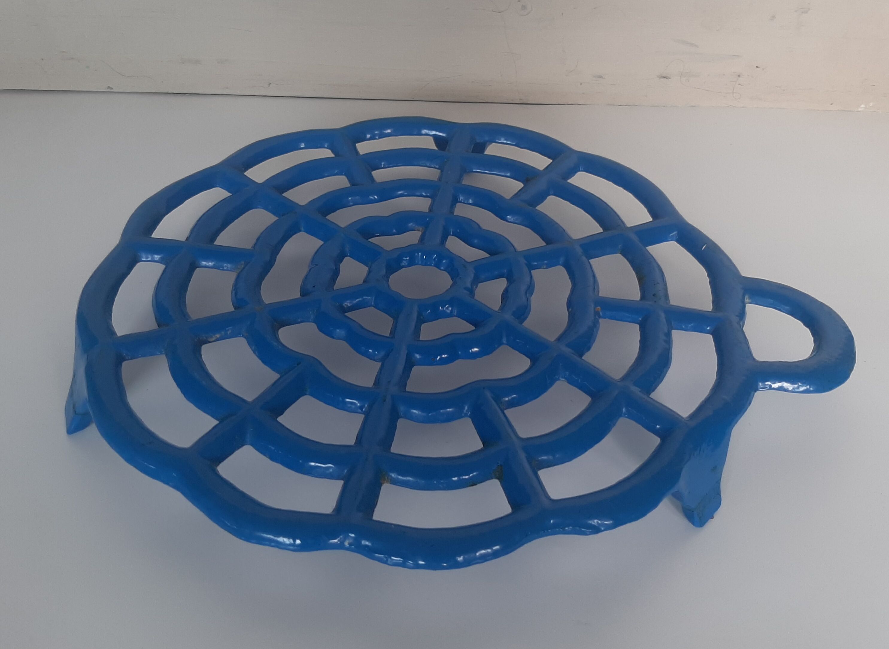 Old blue vintage enamelled table mat