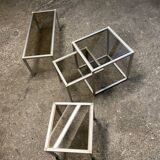 Set of coffee tables, pedestal tables and nesting tables in smoked glass and metal