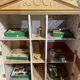 Large wooden dollhouse with miniature furniture