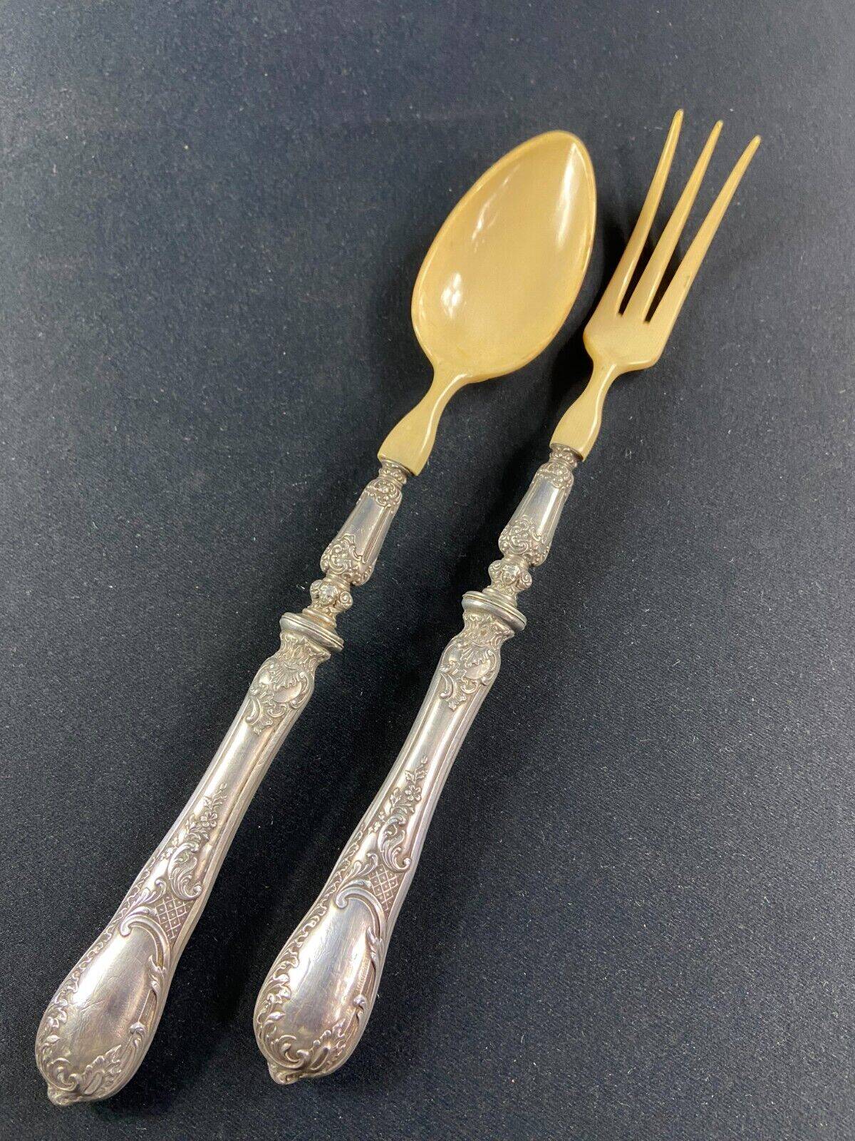 Salad service silver handles Regency decoration with cherub heads