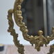 Adjustable psyche mirror of 33 centimeters in gilded bronze with angel ornament