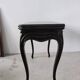 Molded blackened wooden play table, arched legs, green felt