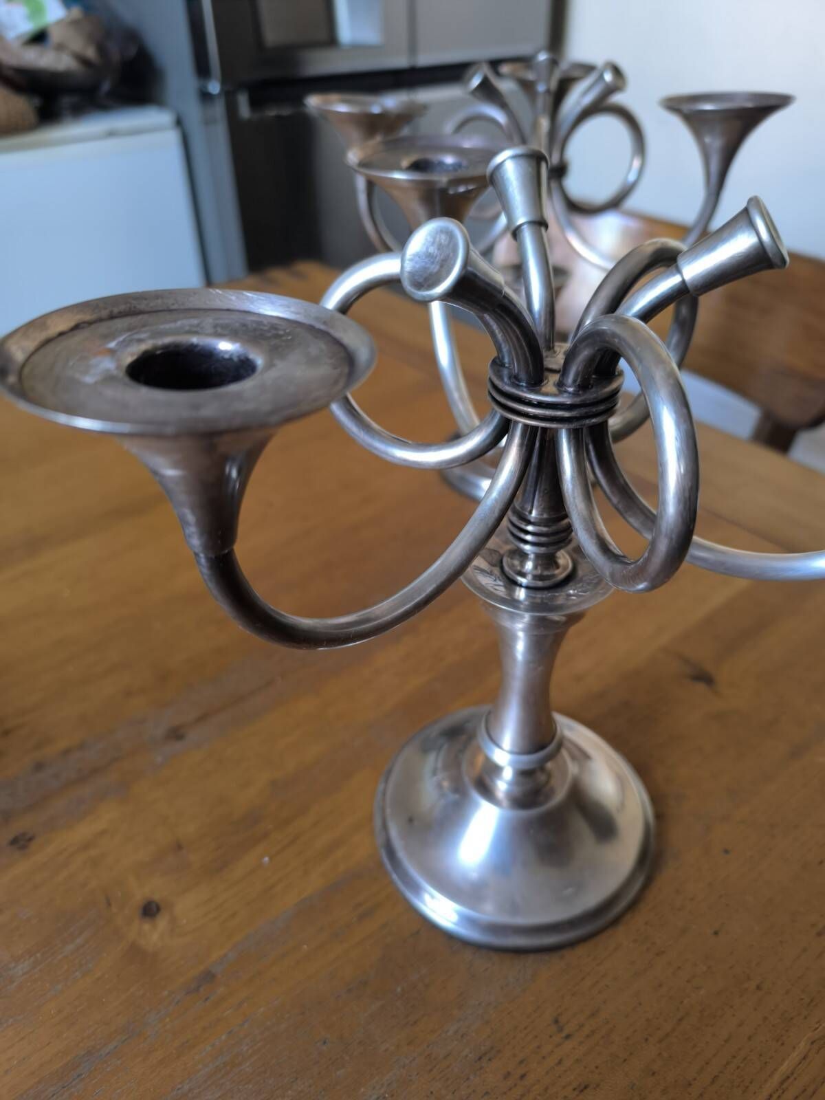 Ercuis pair of candlesticks model Cheverny in silver-plated metal with hunting horn decoration.
