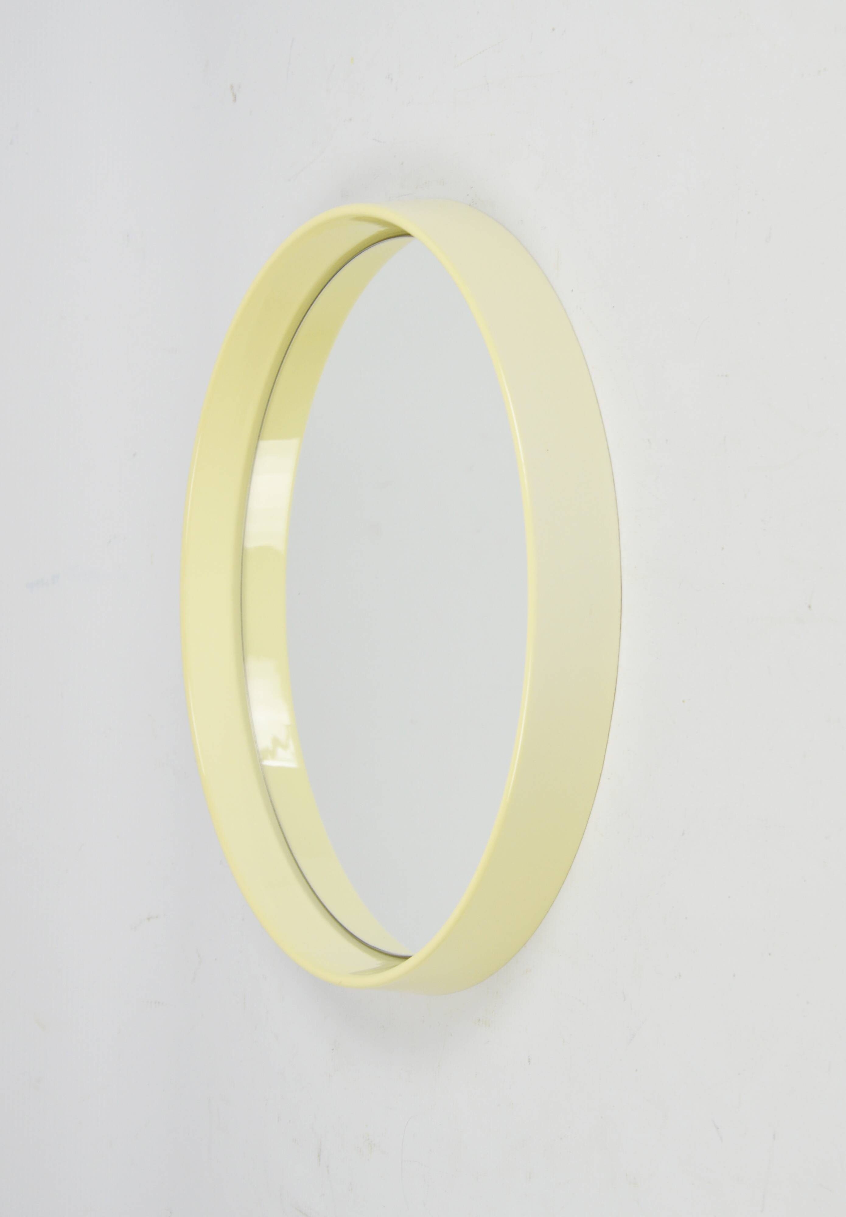 Round mirror in a deep frame, 1970s.