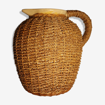 Ancient straw and rattan jug
