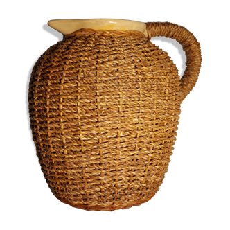 Ancient straw and rattan jug