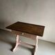 Rustic pink painted desk with brown tabletop