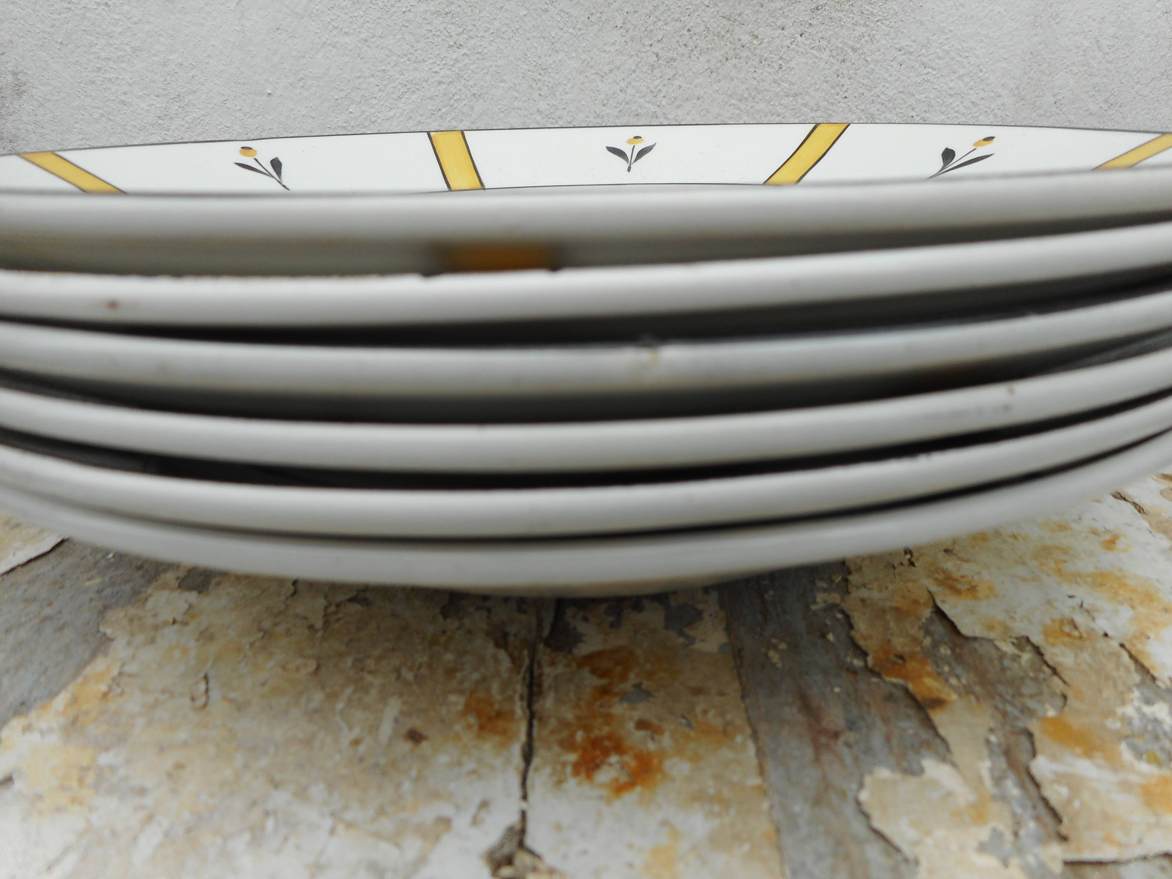 Six hollow plates made of earthenware