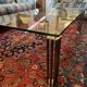 Vintage Hollywood coffee table - Glass, brass, and fluted legs.