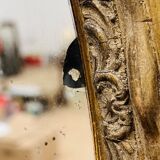 Large golden oval mirror