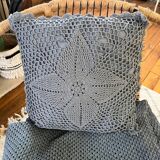 Blue crocheted bedspread and its vintage cushion