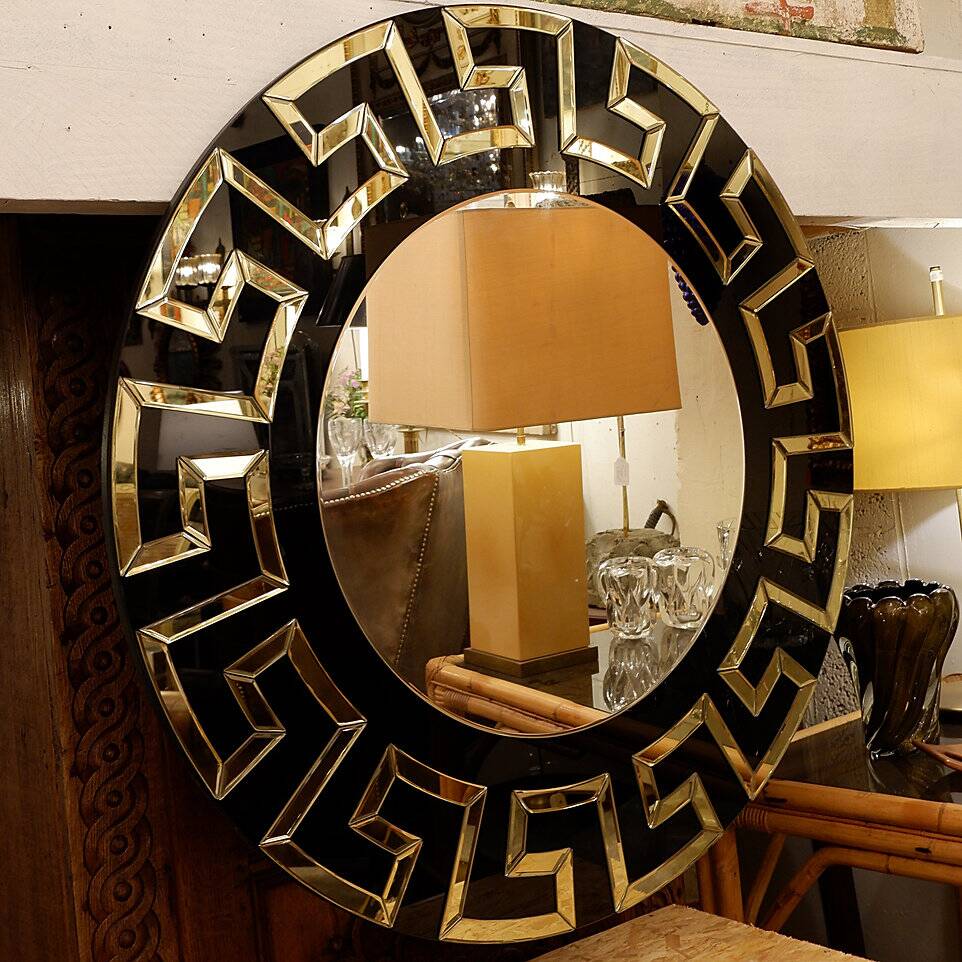 Pair of black and gold glass mirrors