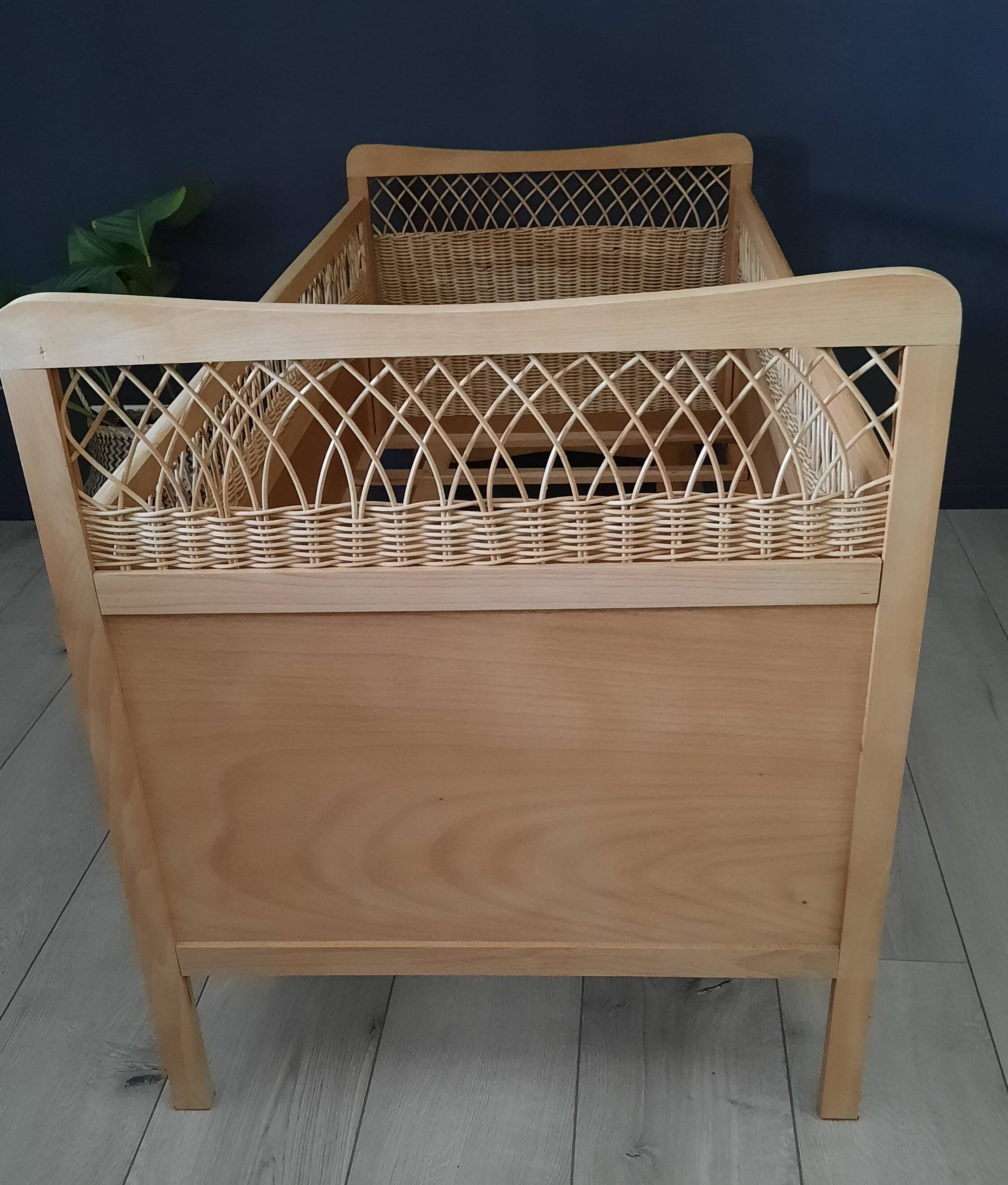 Restored vintage wooden and rattan basket baby bed