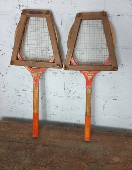 Pair of vintage Majestic tennis rackets with press.