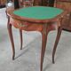 Half-moon gaming table in Louis XV style, made of precious wood marquetry.