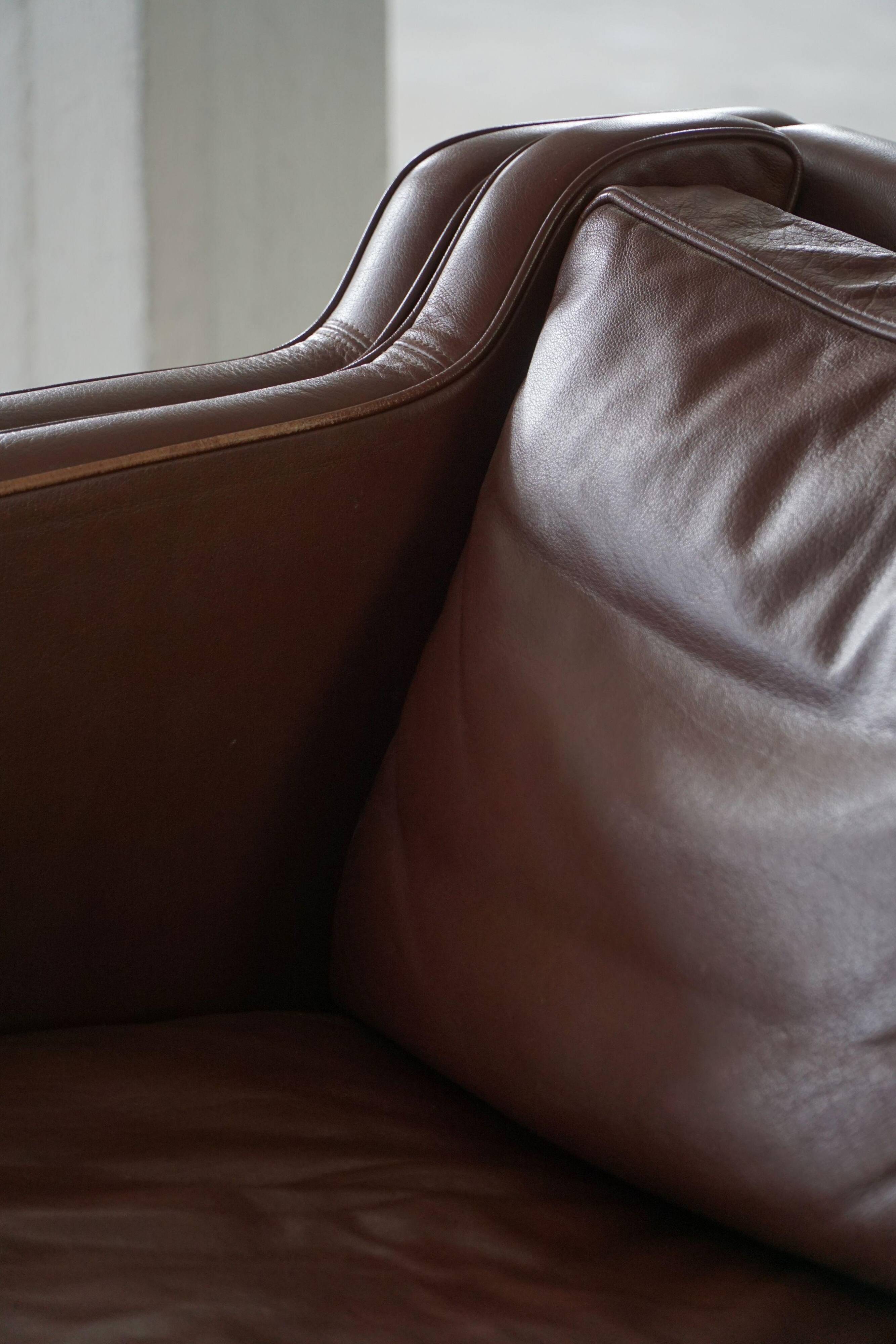 Stouby Møbelfabrik, two-seater sofa in mid-century style in brown leather, 1970s.