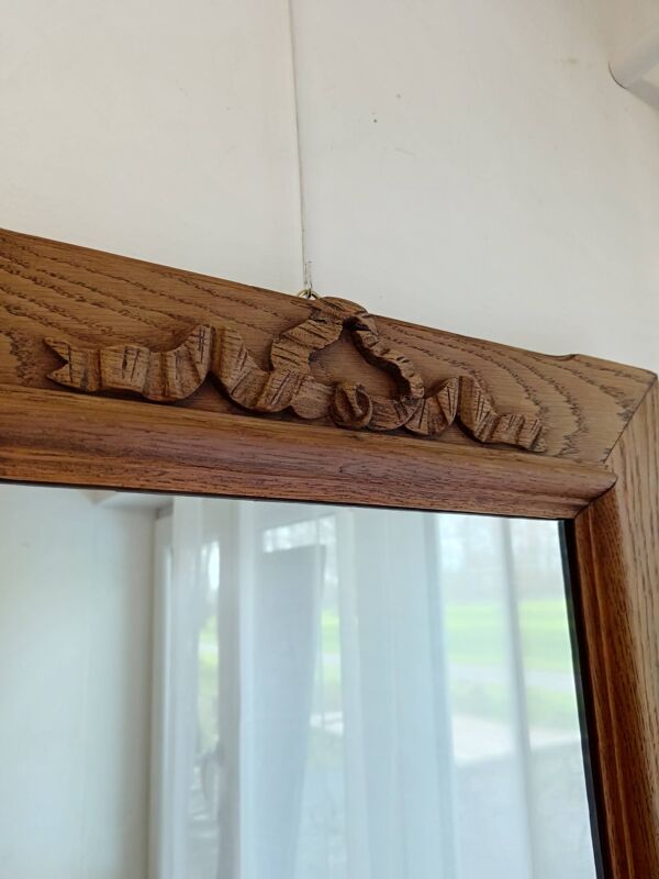 Miroir ancien à noeud en chêne clair