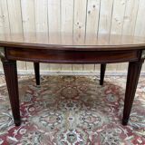 Oval dining table in Louis XVI style made of mahogany.