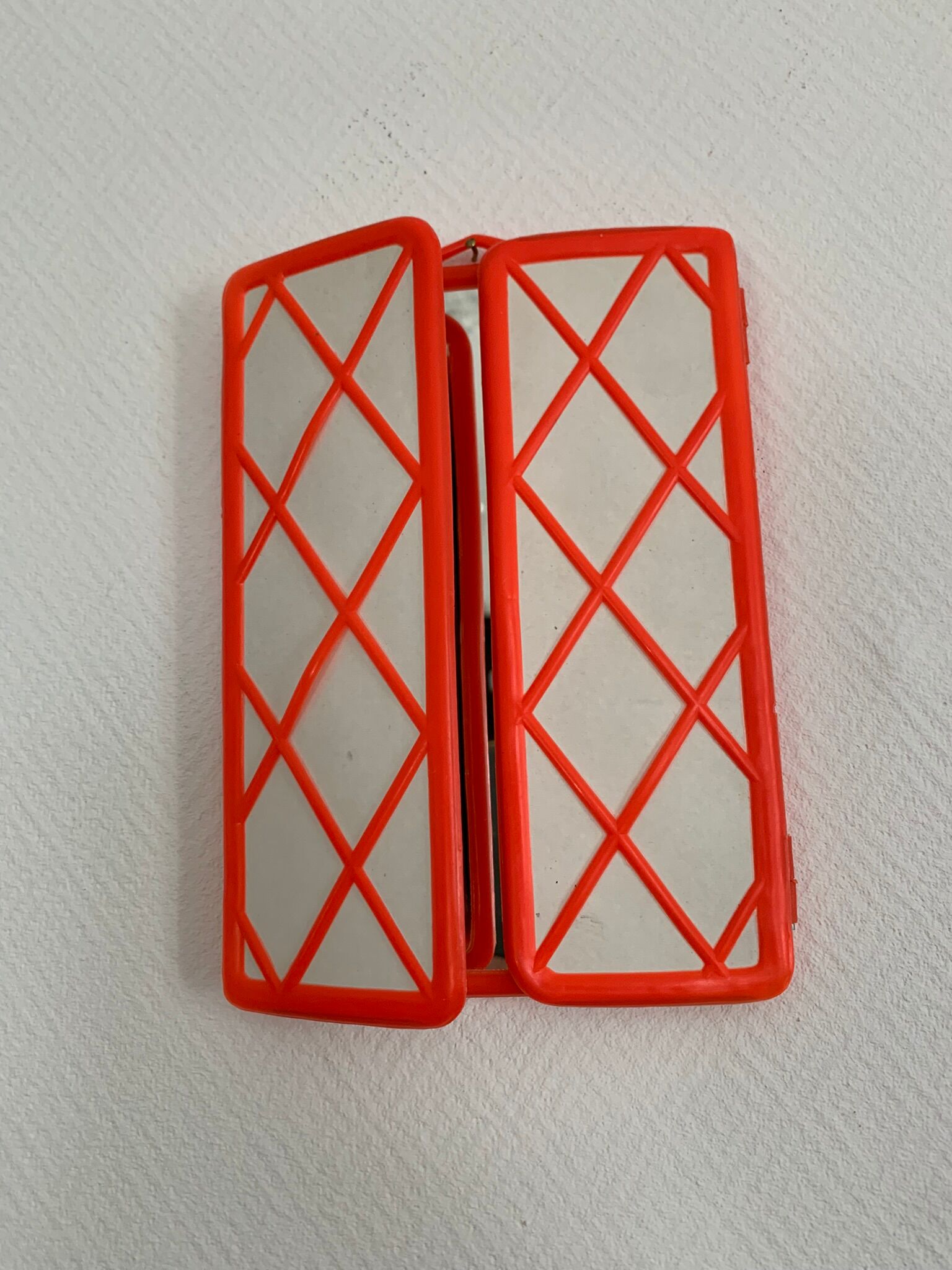 Orange plastic triptych mirror