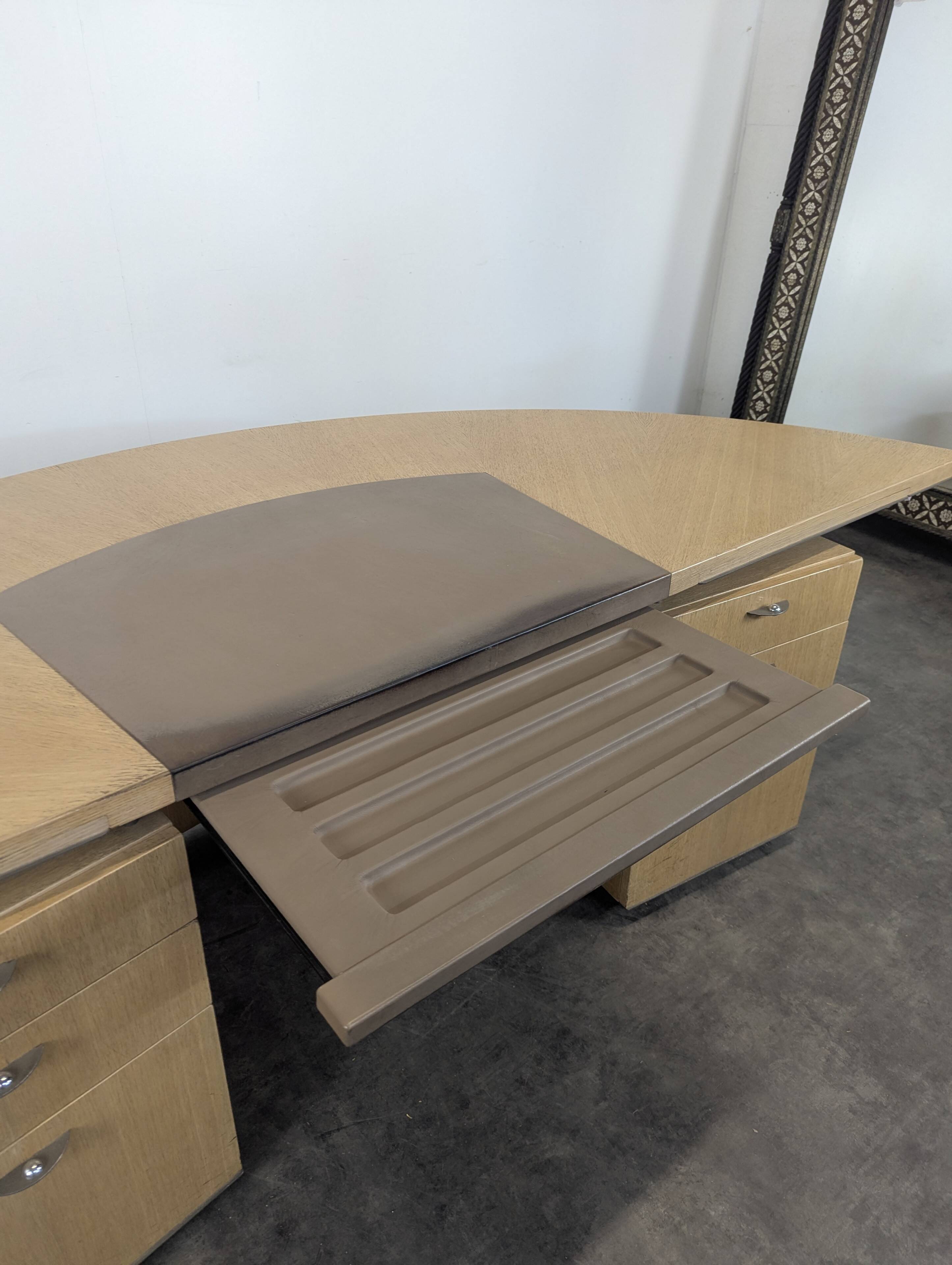 Large semicircular desk by André Putman published by Ecart International.