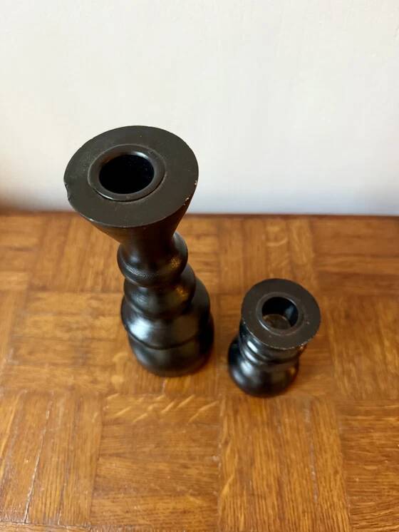 Pair of black turned wood candlesticks