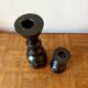 Pair of black turned wood candlesticks