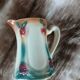 Antique slipware milk jug