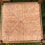 4 wood and straw chairs