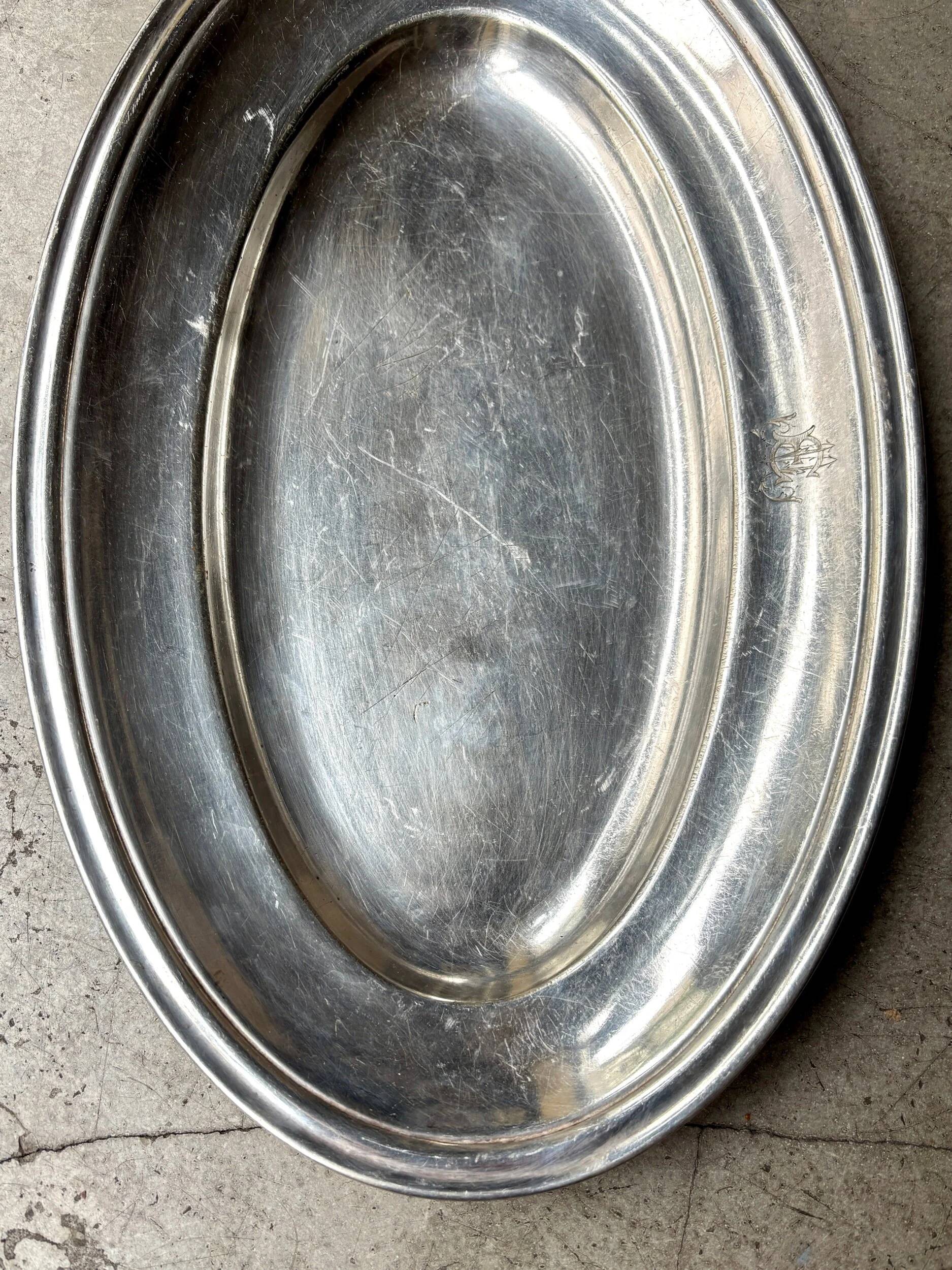 Oval silver-plated metal dish monogrammed "EM"