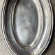 Oval silver-plated metal dish monogrammed "EM"