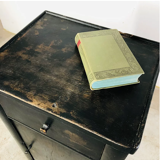 Antique black patinated bedside table
