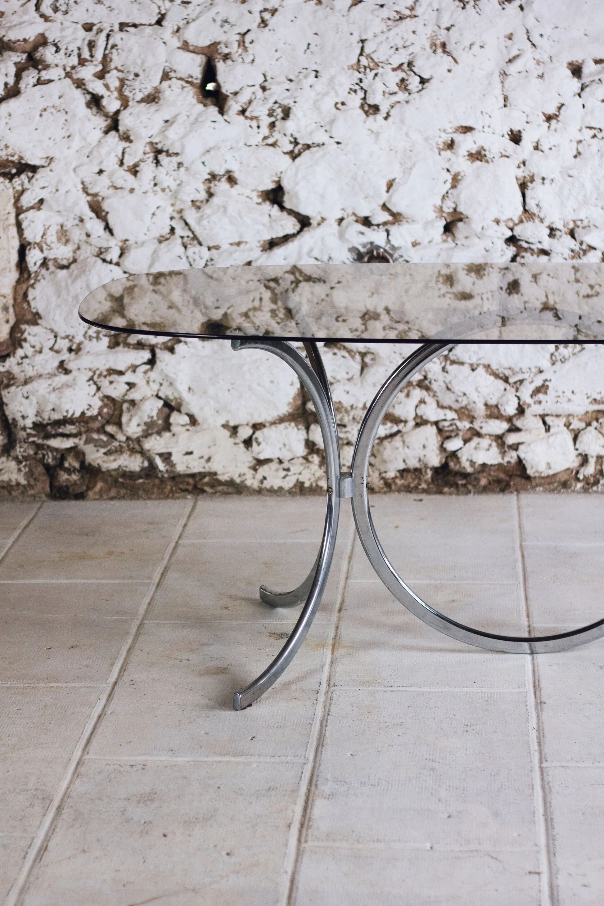 Chrome and smoked glass dining table in the style of Gastone Rinaldi, 1970.