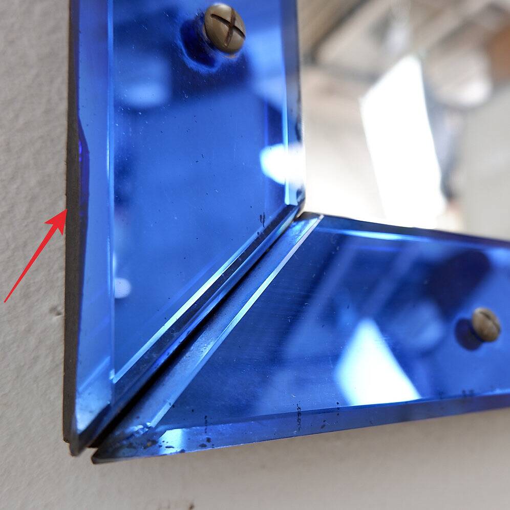 Mirror with coloured glass frame, Italy, circa 1950.