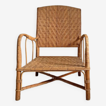 Large armchair in woven rattan and bamboo structure