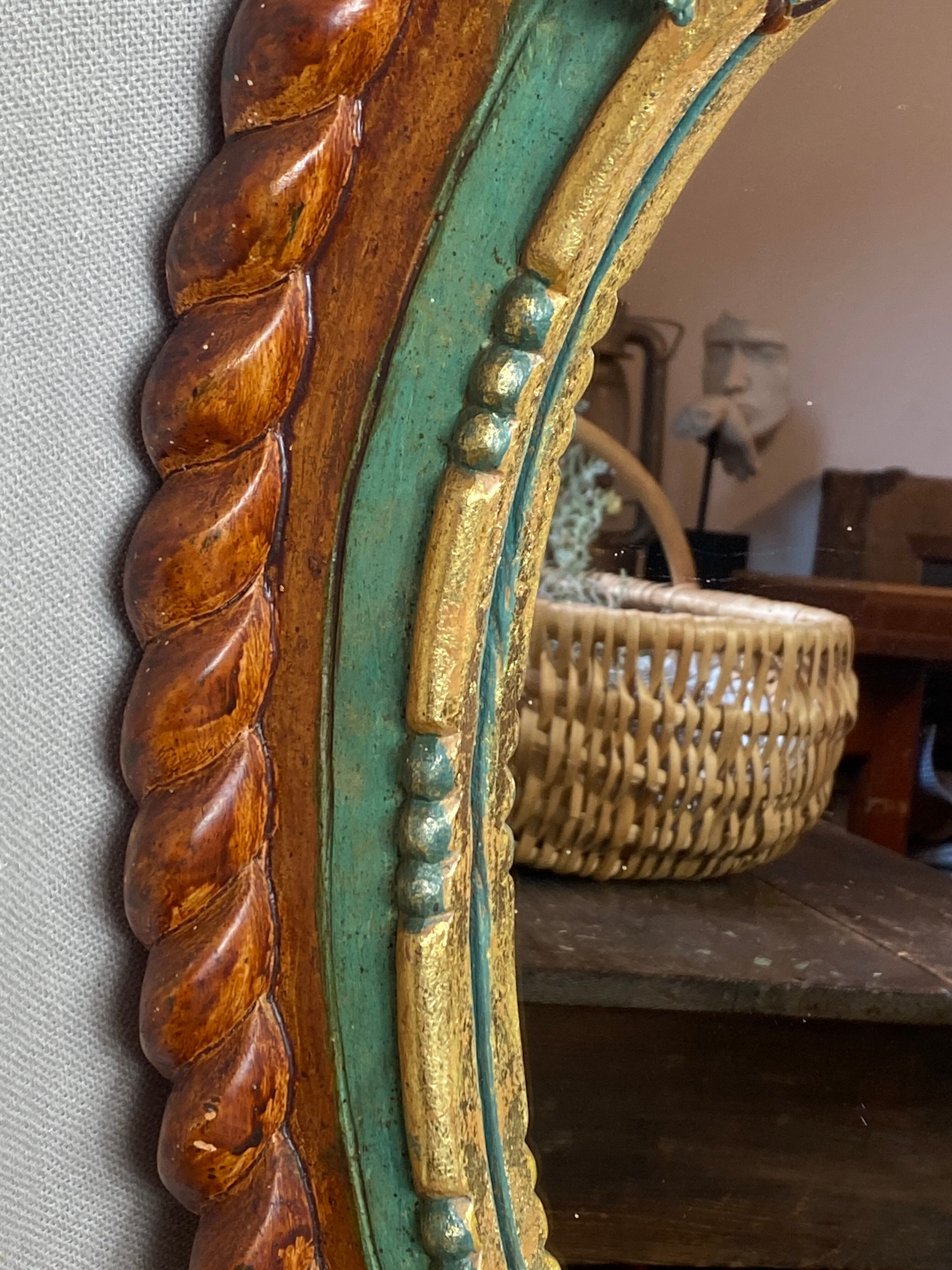 Oval mirror in carved wood