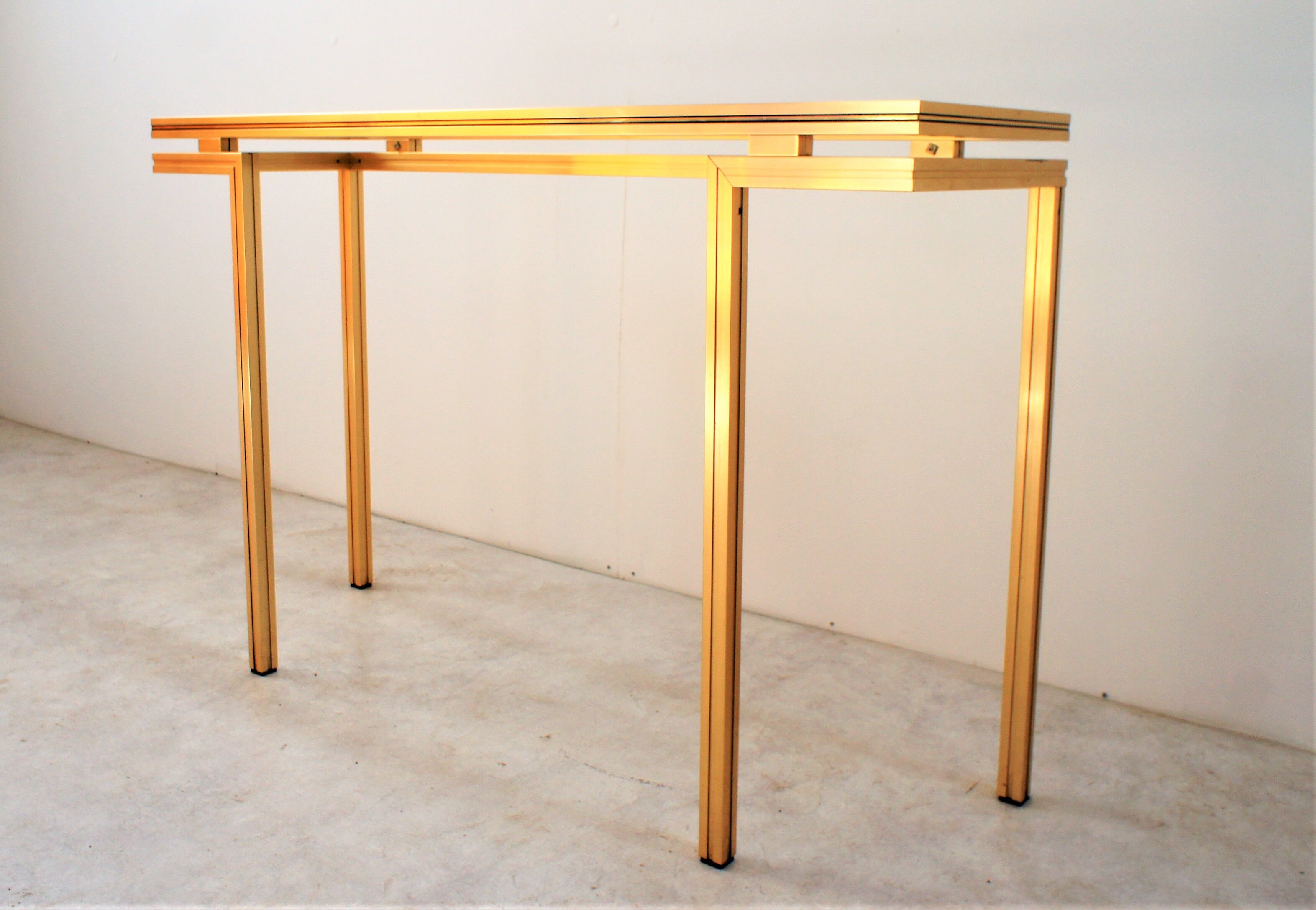 Gold metal console, Pierre Vandel