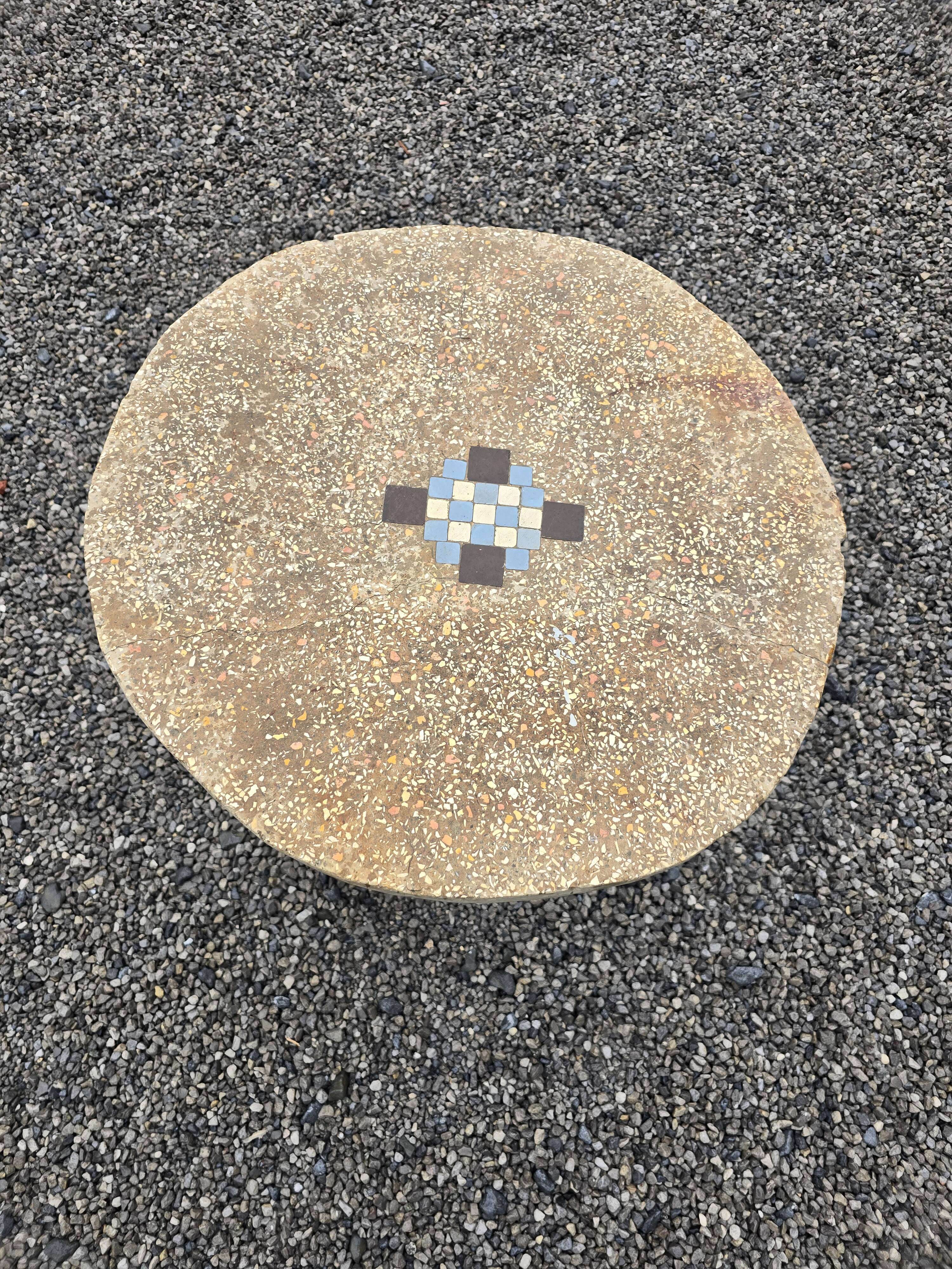 Cement garden table with trunk-shaped foot