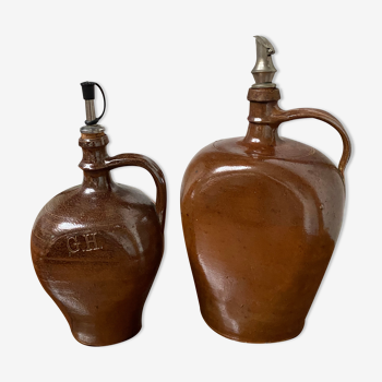 Pair of bottles in sandstone