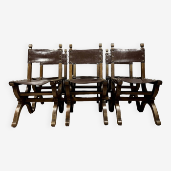 Series of 6 medieval style chairs in solid wood and leather from the 19th century circa 1850