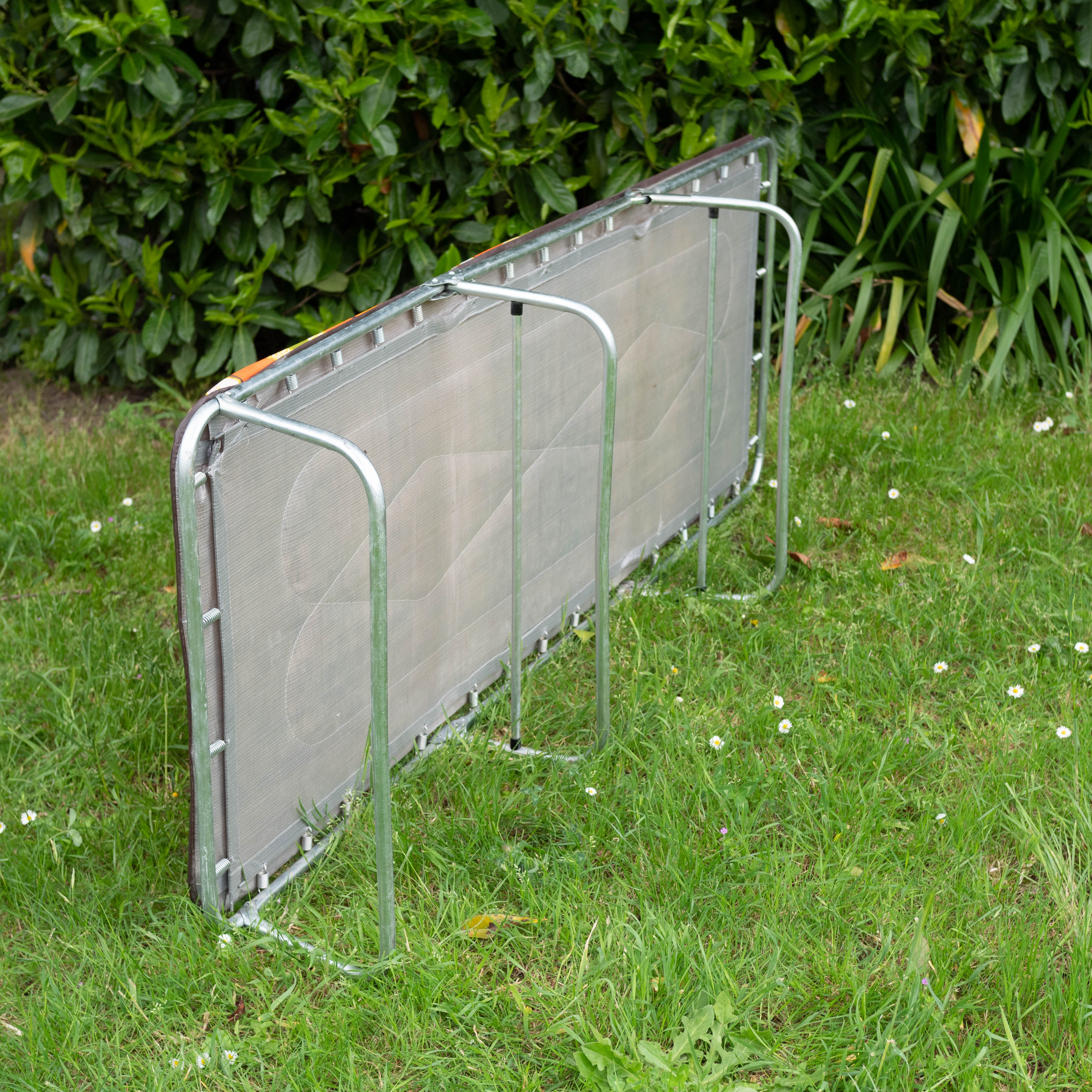 Vintage camp bed with orange flowers