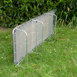 Vintage camp bed with orange flowers